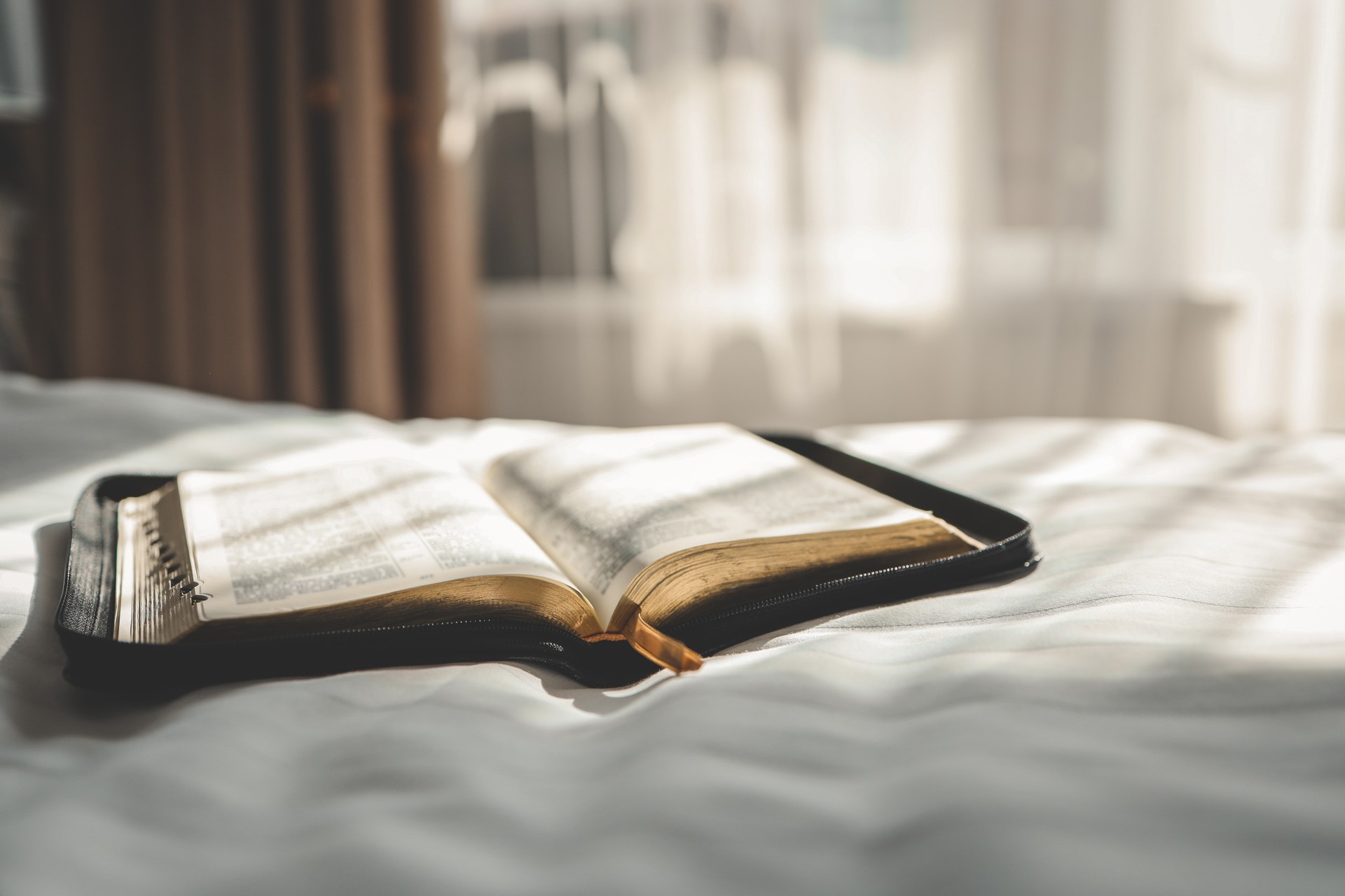 Open Bible on the bed, morning prayer